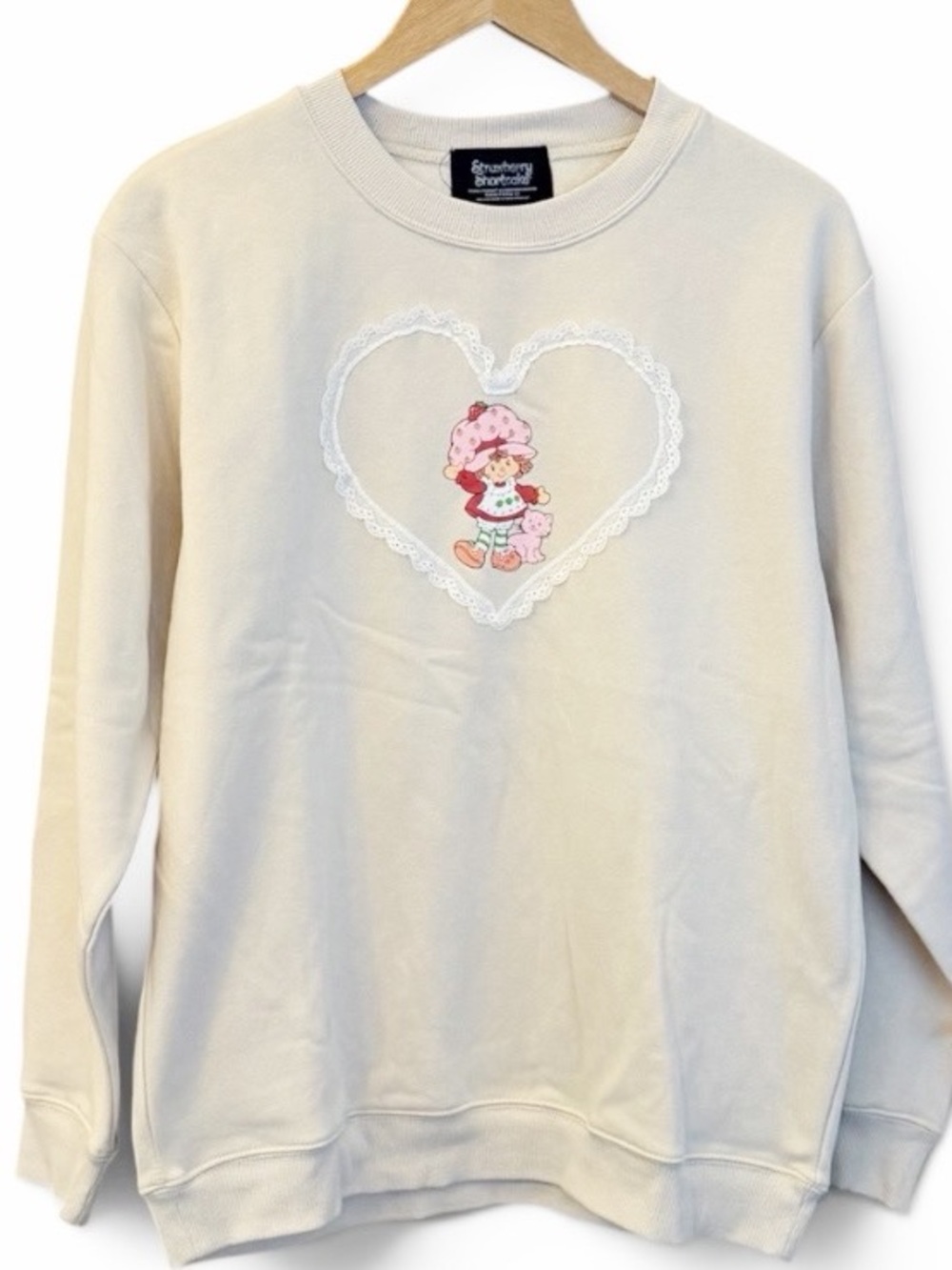 NWOT Strawberry Shortcake Cream Heart Graphic Sweatshirt with Pink Floral Motif